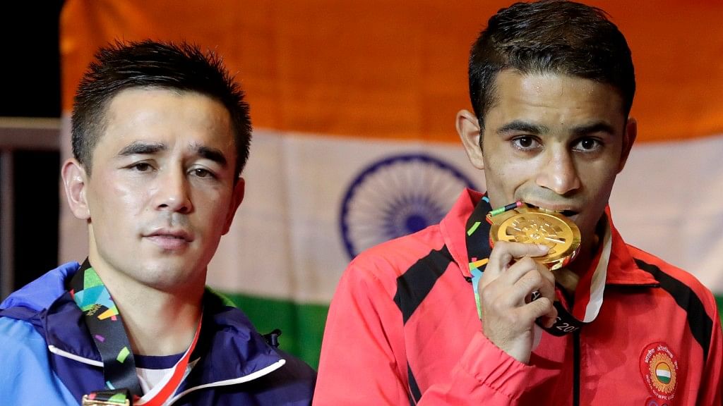 Amit Panghal (in red)&nbsp;defeated Rio Olympic champion Hasanboy Dusmatov of Uzbekistan to win a gold at the Asiad. 
