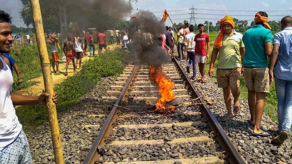 Swarn Sen activists burn tyres on railway tracks in Patna.&nbsp;