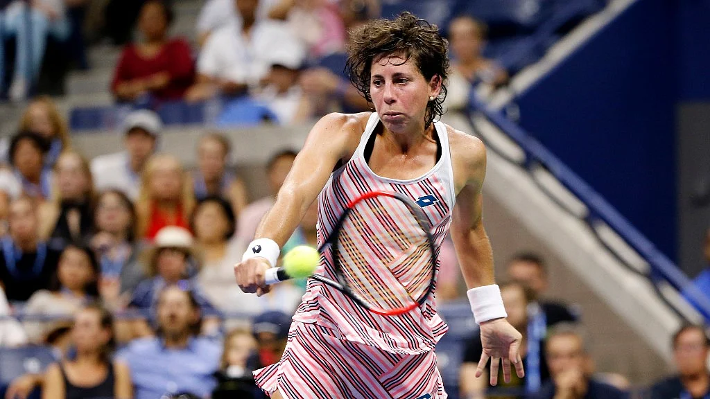 Spaniard Suarez Navarro returns a shot.