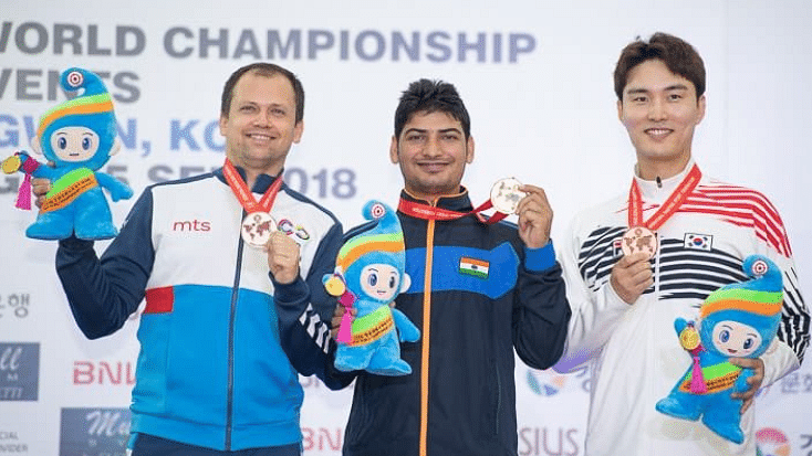 Mitharwal (centre) at the podium of the ISSF world championship.