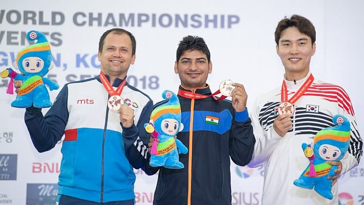 Mitharwal (centre) at the podium of the ISSF world championship.