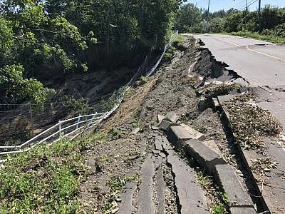 HOKKAIDO, Sept. 6, 2018 (Xinhua) -- Photo taken on Sept. 6, 2018 shows a damaged road after an earthquake in the town of Atsuma, Hokkaido prefecture, Japan. Nine people were confirmed dead and 300 people were injured after a strong earthquake rocking Japan