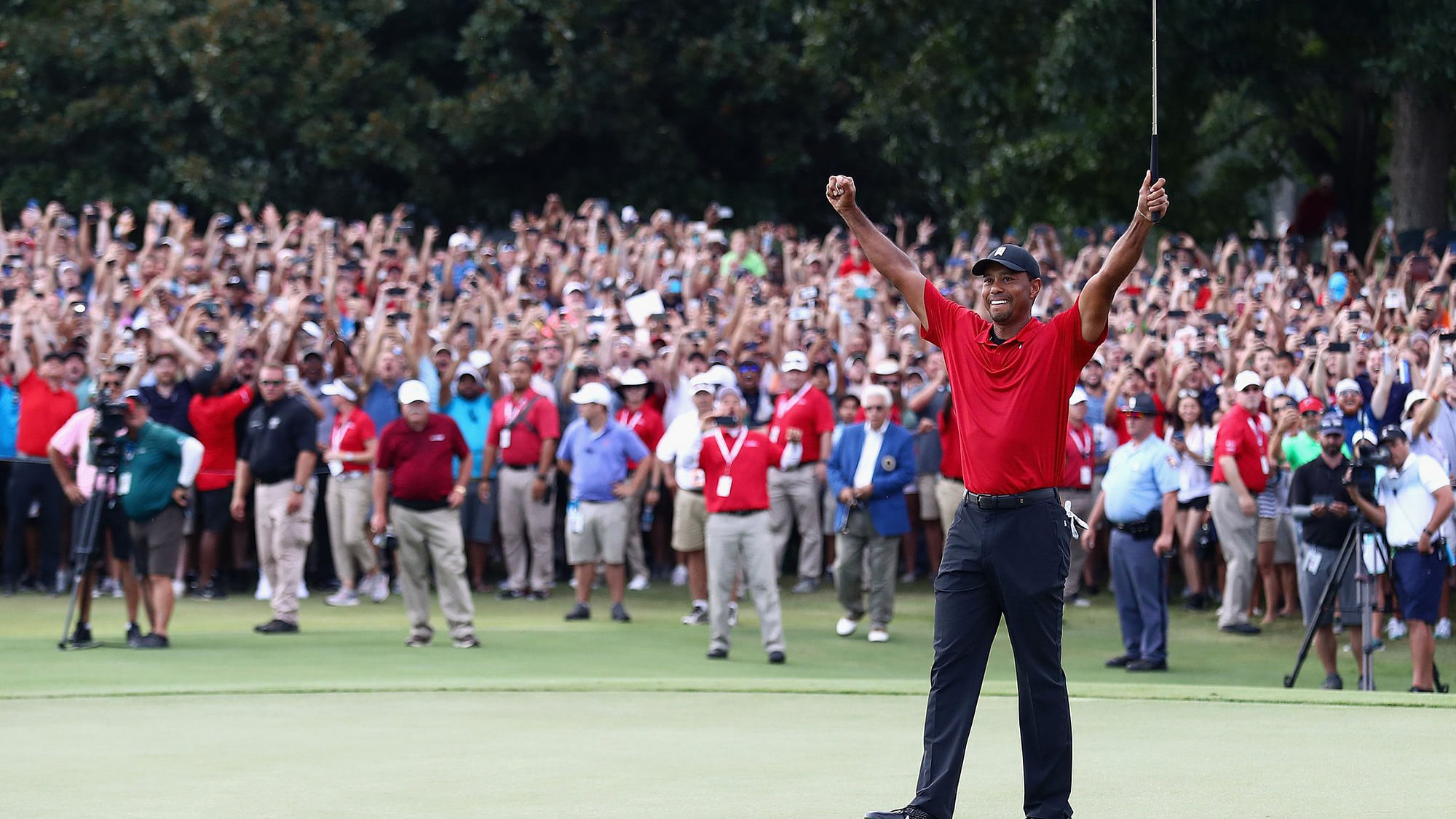 Tiger Woods celebrates his first title in five years, at the Tour Championship.