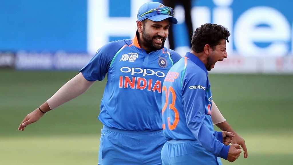 Indian skipper Rohit Sharma celebrating with Kuldeep Yadav the fall of Babar Azam’s wicket.