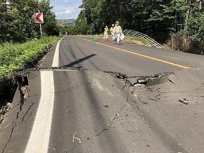 HOKKAIDO, Sept. 6, 2018 (Xinhua) -- Photo taken on Sept. 6, 2018 shows a damaged road after an earthquake in the town of Atsuma, Hokkaido prefecture, Japan. Nine people were confirmed dead and 300 people were injured after a strong earthquake rocking Japan
