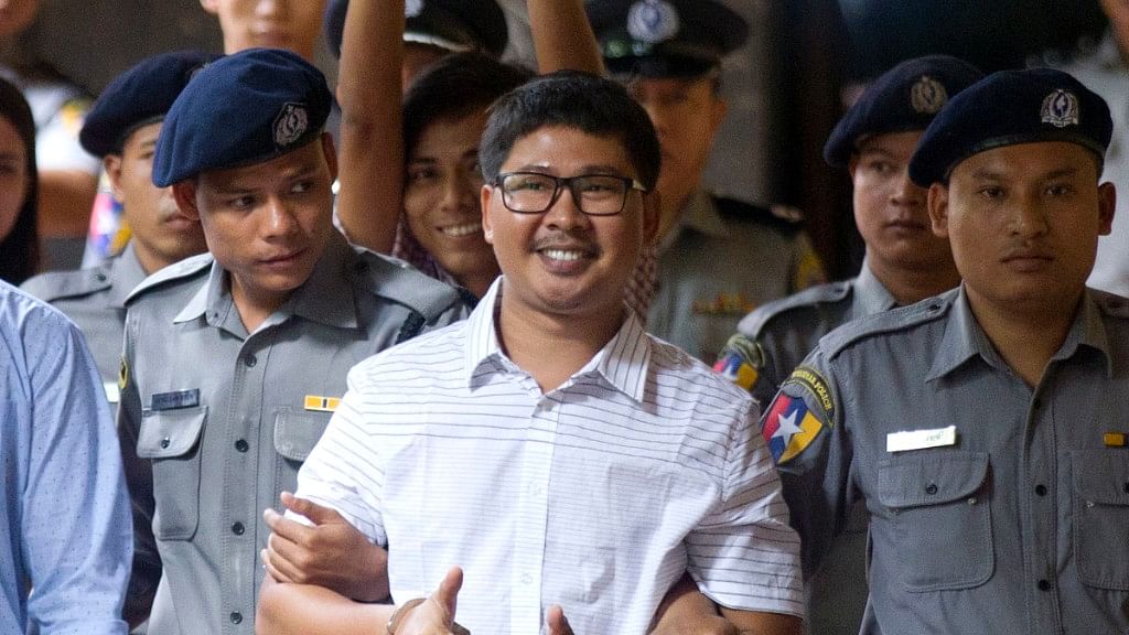 File photo of two Reuters’ journalists, Wa Lone, center, and Kyaw Soe Oo.