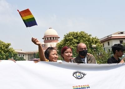 New Delhi: LGBTIQ (lesbian, gay, bisexual, transgender/transsexual, intersex and queer/questioning) supporters celebrate after the Supreme Court in a landmark decision decriminalised homosexuality by declaring Section 377, the penal provision which criminalised gay sex, as "manifestly arbitrary"; in New Delhi on Sept 6, 2018. (Photo: IANS)