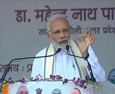 Varanasi: Prime Minister and BJP leader Narendra Modi addresses during a party meeting, in Varanasi, on Sept 18, 2018. (Photo: IANS/BJP)
