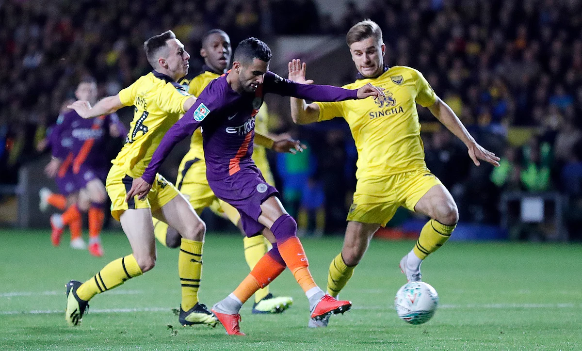 Manchester City’s Riyad Mahrez shoots on goal to score his side’s second goal during the English League Cup soccer match between Oxford United and Manchester City.