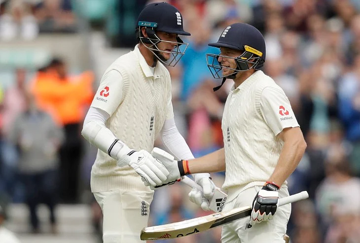 England’s Jos Buttler (right) is congratulated by England’s Stuart Broad after he reached his fifty at the Oval in London on Saturday. 