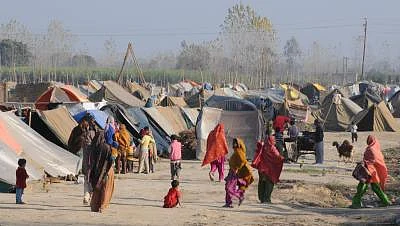 They survived the bloody riots in September, but the winter chill seems determined to do some real harm to over 50,000 people displaced during the Muzaffarnagar riots and now living in dozen-odd relief camps. One of these - Malakpur relief camp in Shamli district -- in pictures offers no respite to riot-affected people - women, aged and children alike. The December chill has reportedly claimed lives of 34 children so far. More are likely to lose the battle against damp and dew in the coming mont