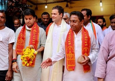 Chitrakoot: Congress president File Photo: Rahul Gandhi, Jyotiraditya Madhavrao Scindia and Kamal Nath during their visit to the Kamtanath Temple in Chitrakoot, Madhya Pradesh on Sept 27, 2018. 
