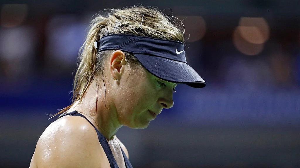 Maria Sharapova reacts after losing to Carla Suarez Navarro in the US Open.