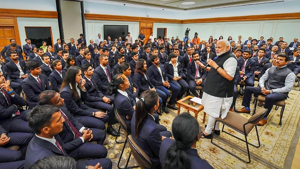 Prime Minister Narendra Modi interacting with Asian Games medallists at his residence on Wednesday.&nbsp;