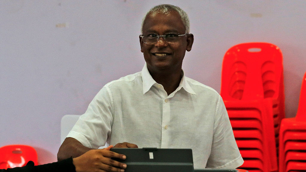 Maldives’ opposition presidential candidate Ibrahim Mohamed Solih casts his vote at a polling station during presidential election day in Male.