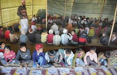 They survived the bloody riots in September, but the winter chill seems determined to do some real harm to over 50,000 people displaced during the Muzaffarnagar riots and now living in dozen-odd relief camps. One of these - Malakpur relief camp in Shamli district -- in pictures offers no respite to riot-affected people - women, aged and children alike. The December chill has reportedly claimed lives of 34 children so far. More are likely to lose the battle against damp and dew in the coming mont