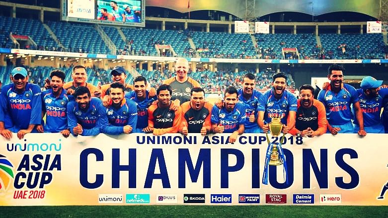 Indian players and team support staff celebrate with the Asia Cup.