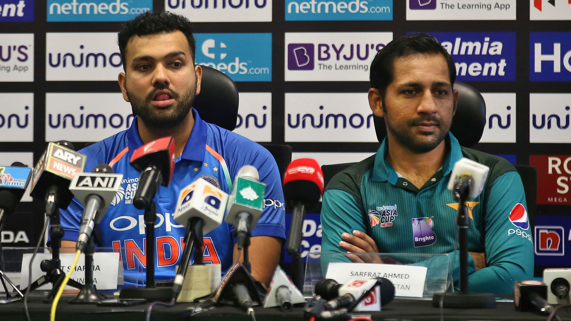 Rohit Sharma and Sarfraz Ahmed during a press conference ahead of Asia Cup.&nbsp;