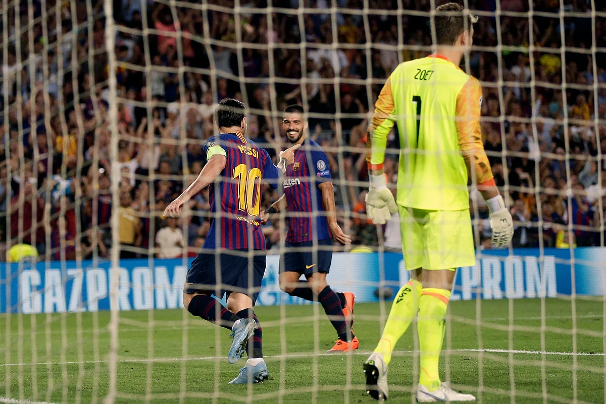 Barcelona forward Lionel Messi, left, celebrates after scoring his side’s third goal during the group B Champions League soccer match between FC Barcelona and PSV Eindhoven at the Camp Nou stadium in Barcelona, Spain, Tuesday, Sept. 18, 2018. 