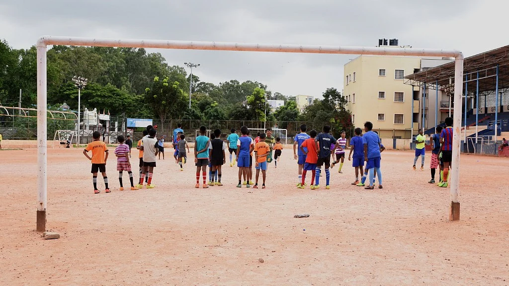 The Gowthamapuram stadium is a little more than half the size of a regular football field, with a couple of goal posts on one side and a concrete stand at the other.
