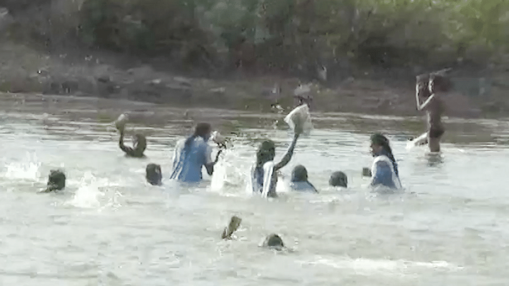  Students from Madhya Pradesh’s Harda district wade through river Ganjal daily to reach school.
