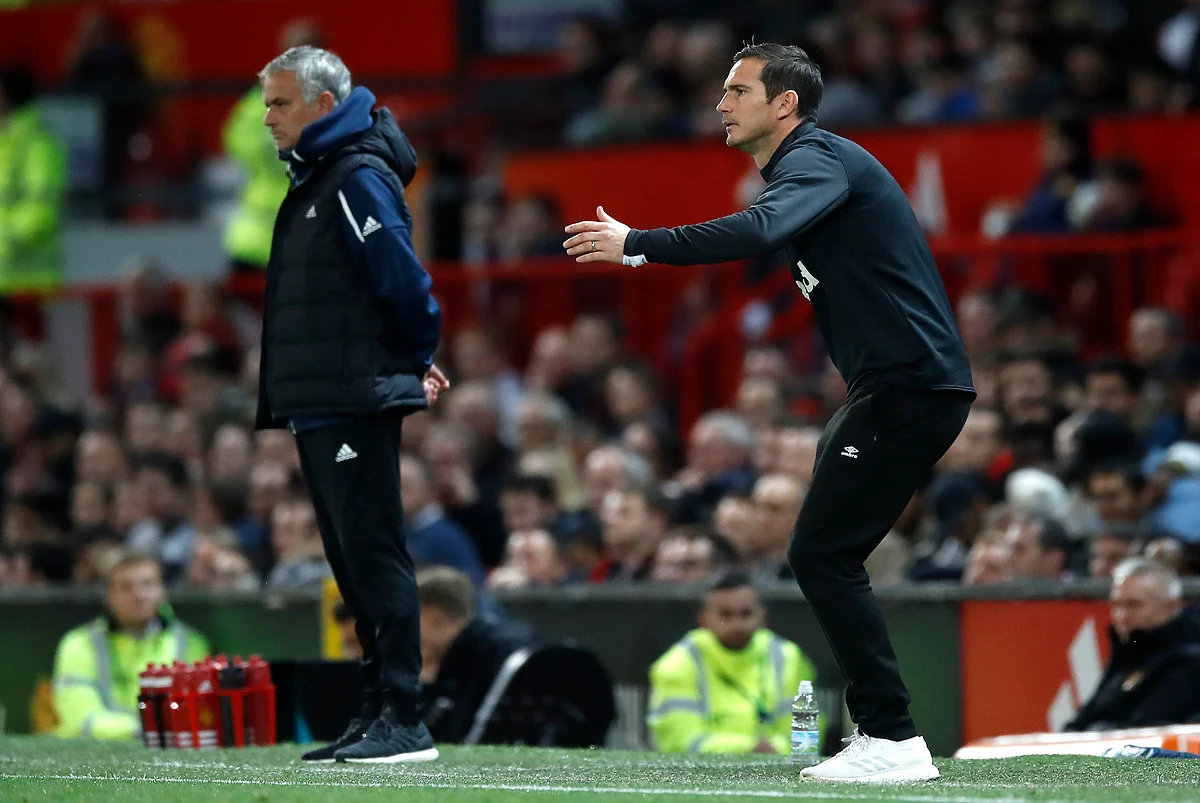 Derby County manager Frank Lampard gestures on the touchline with Manchester United manager Jose Mourinho, left, during their English League Cup.