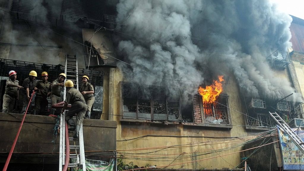 Fire fighters busy dousing the massive fire at Bagree Market, a wholesale market in Kolkata.