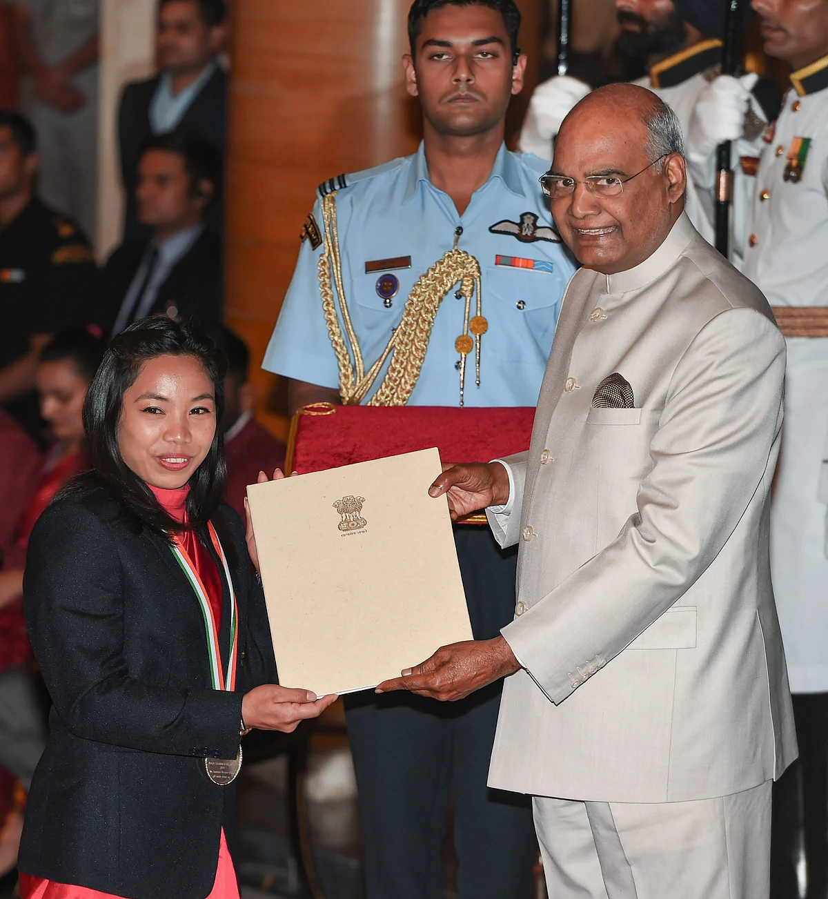 President Ram Nath Kovind confers Rajiv Gandhi Khel Ratna Award on weightlifter Mirabai Chanu at the National Sports and Adventure Award 2018 function.