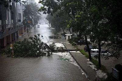 HONG KONG, Sept. 16, 2018 (Xinhua) -- Photo taken on Sept. 16, 2018 shows a waterlogged road in Hong Kong, south China. Hurricane Signal No. 10, the top level warning, was issued by the Hong Kong Observatory at 9:40 a.m. local time on Sunday, and was replaced by the second highest warning Southeast Gale Signal 8 at 7:40 p.m. local time. (Xinhua/Lo Ping Fai/IANS)
