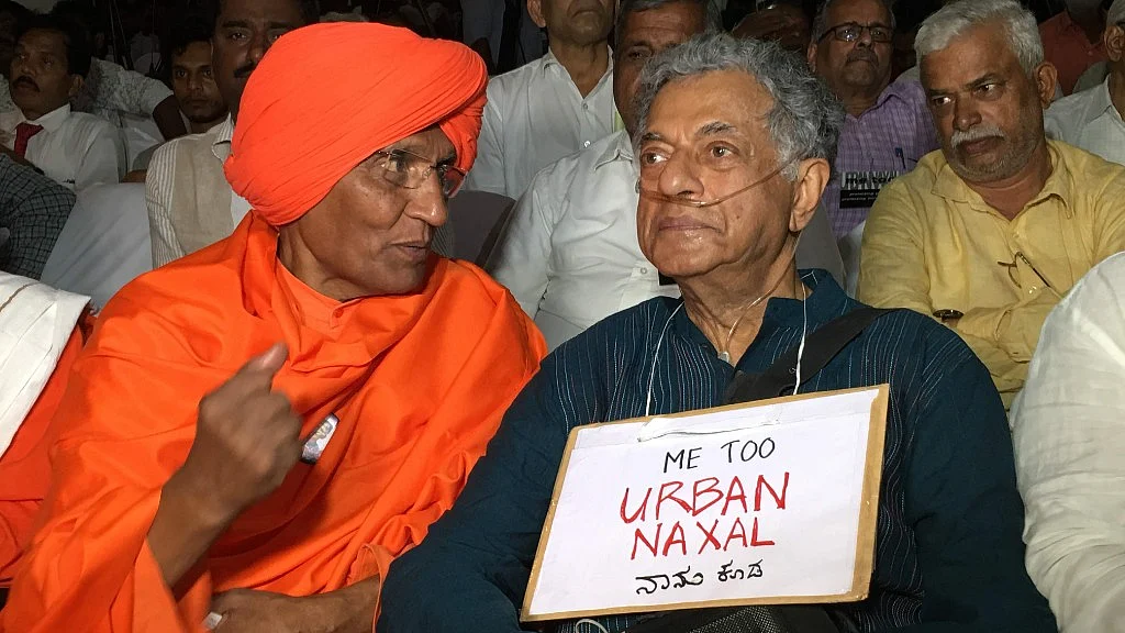 Playwright Girish Karnad wearing a “MeTooUrbanNaxal” placard at a function commemorating Garui Lankesh’s first death anniversary. 
