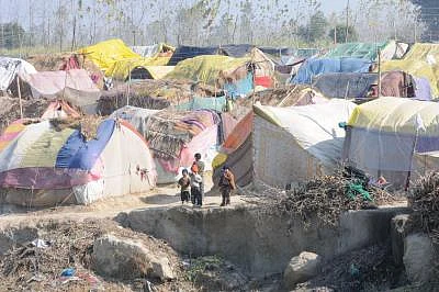 They survived the bloody riots in September, but the winter chill seems determined to do some real harm to over 50,000 people displaced during the Muzaffarnagar riots and now living in dozen-odd relief camps. One of these - Malakpur relief camp in Shamli district -- in pictures offers no respite to riot-affected people - women, aged and children alike. The December chill has reportedly claimed lives of 34 children so far. More are likely to lose the battle against damp and dew in the coming mont