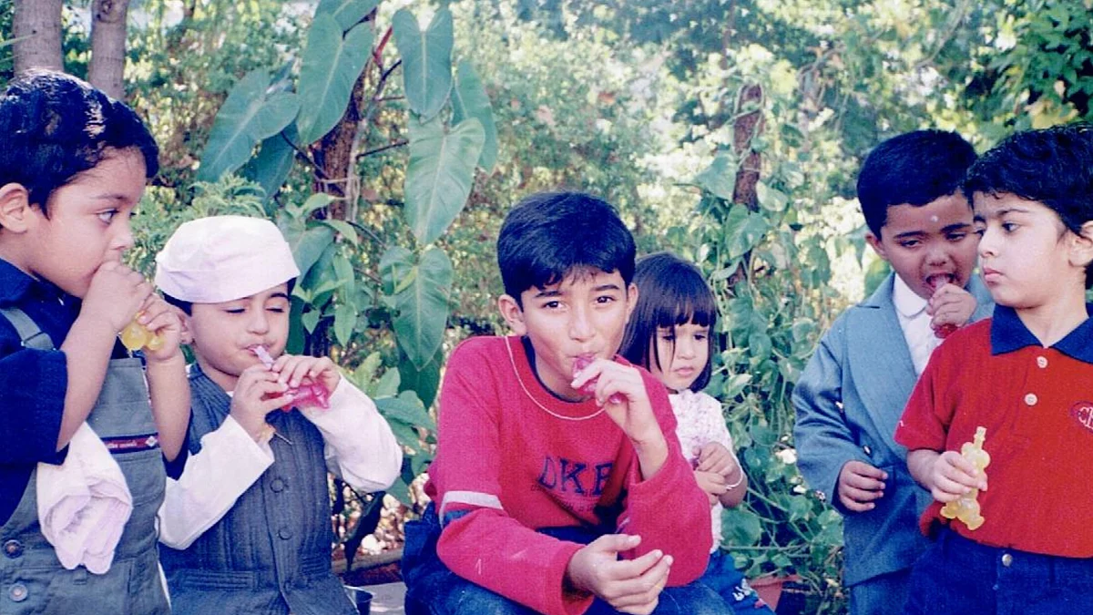 Adi, in the middle, surrounded by other kids from school.
