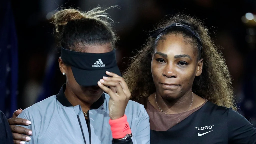 Japan’s Naomi Osaka is hugged by Serena Williams after Osaka defeated Williams in the women’s final of the US Open tournament on Saturday.