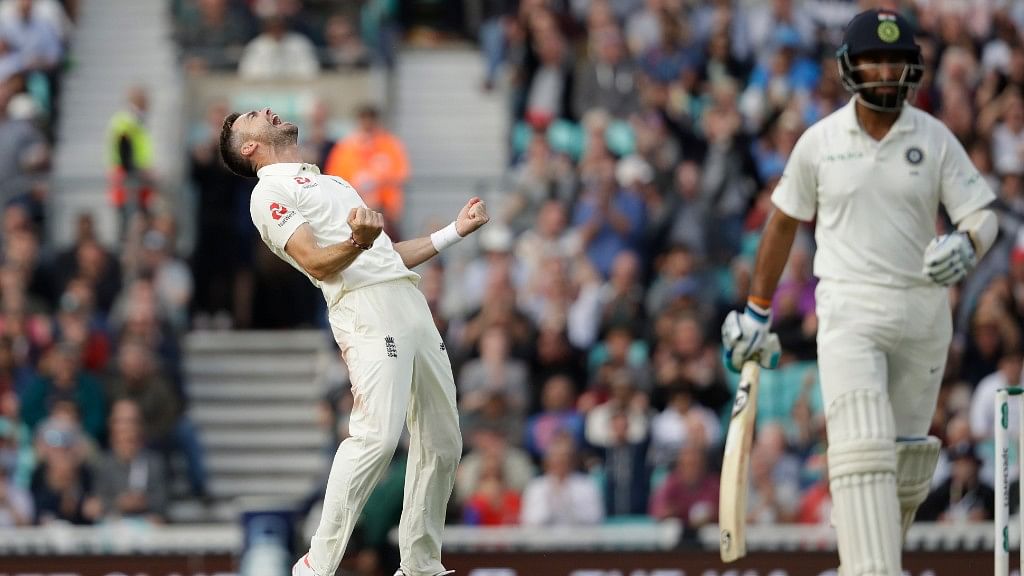 James Anderson celebrates after dismissing Cheteshwar Pujara on Day 2 of the fifth Test match at the Oval in London on Saturday.&nbsp;