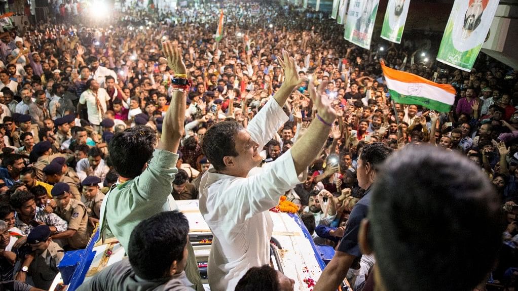 Congress President Rahul Gandhi waves at his supporters at Rewa in Madhya Pradesh