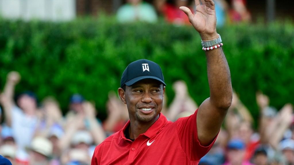 Tiger Woods celebrates on the 18th green after wining the Tour Championship golf tournament on Sunday, September 23, 2018, in Atlanta.