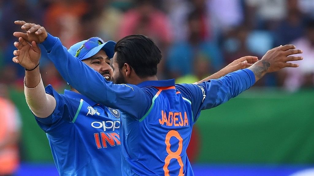 Indian skipper Rohit Sharma and Ravindra Jadeja celebrate the fall of a Bangladeshi wicket on Friday.&nbsp;