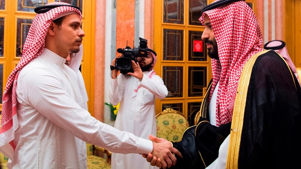 In this photo released by Saudi Press Agency, SPA, Saudi Crown Prince Mohammed bin Salman (right) shakes hands with Salah Khashoggi, son of Jamal Khashoggi, in Riyadh, Saudi Arabia on 23 October, 2018.