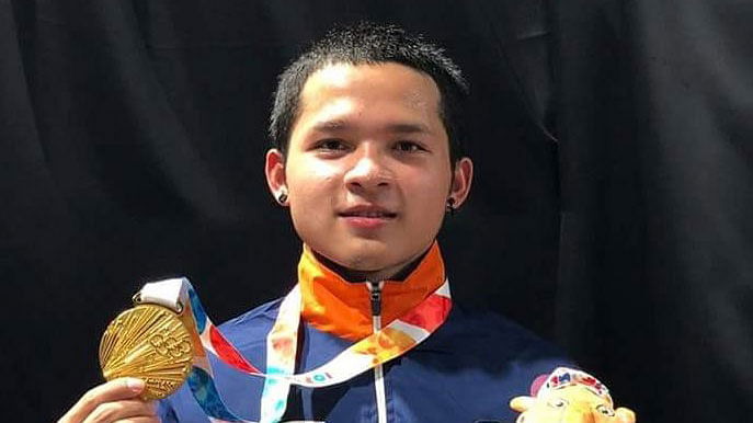 Jeremy Lalrinnunga poses with his Youth Olympics gold medal.