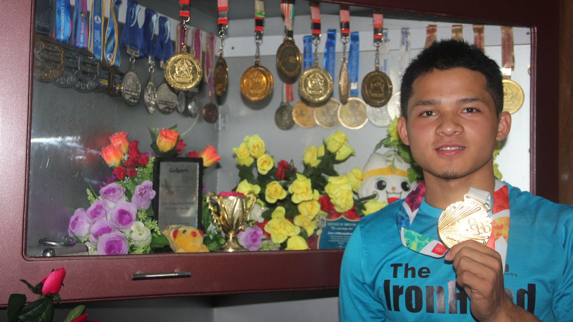 Weightlifter Jeremy Lalrinnunga poses with his medals.