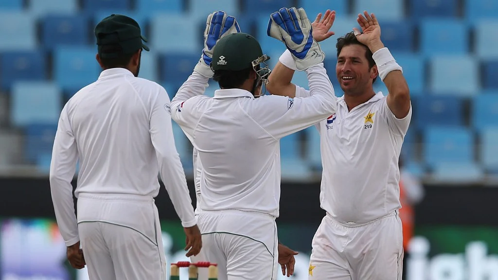Pakistan’s bowler Yasir Shah celebrates with his teammates dismissal of Usman Khawaja during their test match in Dubai in UAE on Thursday.