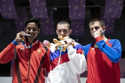 BUENOS AIRES, Oct. 8, 2018 (Xinhua) -- Gold medalist Grigorii Shamakov (C) of Russia, silver medalist Shahu Tushar Mane (L) of India and bronze medalist Aleksa Mitrovic of Serbia pose for photos during the awarding ceremony of the Men