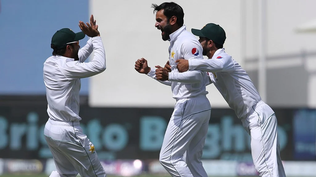 Pakistan’s Wahab Riaz (centre) and teammates celebrate the dismissal of Australia’s Travis Head during their test match in Dubai in UAE on Thursday.