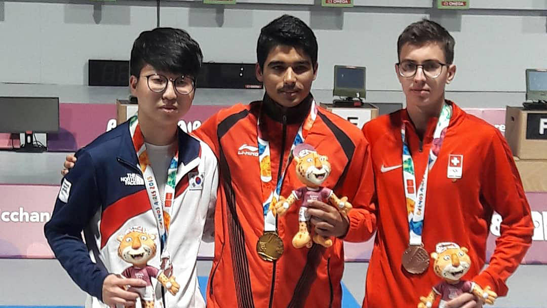 India’s Saurabh Chaudhury (centre) with Korea’s Sung Yunho (left) and  Switzerland’s Solari Jason at the medal ceremony of the men’s 10m air pistol.