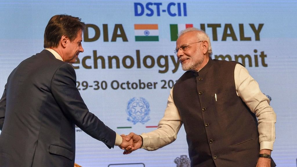 PM Modi shakes hands with Italian PM Conte