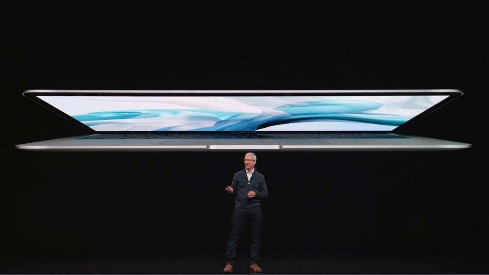 Apple CEO Tim Cook unveiling the new Macbook Air.