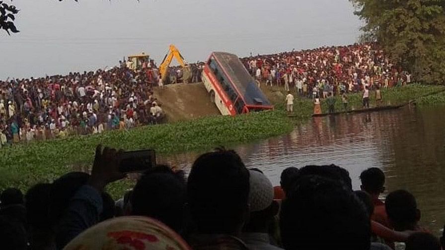 The bus fell into a pond in Assam.&nbsp;