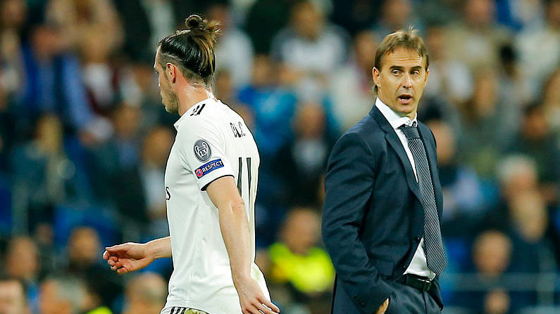 Gareth Bale, left, leaves the field as Real Madrid coach Julen Lopetegui looks on.
