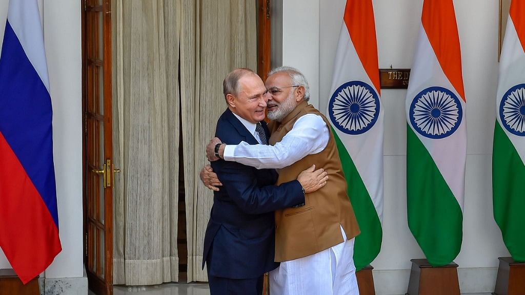 Prime Minister Narendra Modi hugs Russian President Vladimir Putin before their meeting at Hyderabad House, in New Delhi.