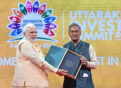Dehradun: Prime Minister Narendra Modi and Uttarakhand Chief Minister Trivendra Singh Rawat at the Uttarakhand Investors Summit 2018, in Dehradun on Oct 7, 2018. (Photo: IANS/PIB)